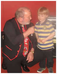 Russell King, magician, with little boy